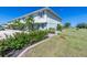 Inviting two-story condo with lush landscaping, palm trees, and convenient parking in a desirable community at 26396 Nadir Rd # 507, Punta Gorda, FL 33983