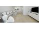 Spacious living room with modern decor, comfortable seating, and a seamless flow into the kitchen area at 26396 Nadir Rd # 507, Punta Gorda, FL 33983