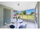 Enjoy serene views from this relaxing screened patio with a table and chairs at 26396 Nadir Rd # 507, Punta Gorda, FL 33983