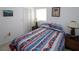 Comfortable bedroom with colorful bedding, side tables with lamps, and a serene atmosphere at 4158 Tamiami Trl # G1, Port Charlotte, FL 33952