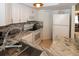 Modern kitchen featuring granite counters, updated appliances, and ample storage at 4158 Tamiami Trl # G1, Port Charlotte, FL 33952