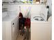 Functional laundry room with modern washer and dryer, providing convenience and efficiency at 4158 Tamiami Trl # G1, Port Charlotte, FL 33952