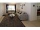Comfortable living room with modern furniture, opening into the dining area at 4158 Tamiami Trl # G1, Port Charlotte, FL 33952