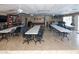 Spacious recreation room featuring tile flooring, ceiling fans, pool table, and ample seating for events at 4158 Tamiami Trl # G1, Port Charlotte, FL 33952