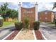 Maria Manor's entrance sign with brick accents, surrounded by well-maintained landscaping at 4158 Tamiami Trl # G1, Port Charlotte, FL 33952