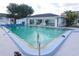 Community outdoor swimming pool featuring clear blue water and lounge area, perfect for relaxation at 4158 Tamiami Trl # G1, Port Charlotte, FL 33952