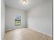A bright bedroom with tile floors and a view of the outdoors at 4425 Lagoon Ter, North Port, FL 34286