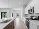 Modern kitchen features stainless steel appliances, subway tile backsplash, and quartz countertops at 4425 Lagoon Ter, North Port, FL 34286