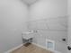 Laundry room featuring a sink and wire shelving at 4425 Lagoon Ter, North Port, FL 34286