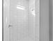 A modern shower with white tile, contrasting grout and overhead lighting at 4425 Lagoon Ter, North Port, FL 34286