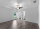 Main bedroom with trey ceiling, tile floors, and en-suite bathroom access at 4453 Lagoon Ter, North Port, FL 34286
