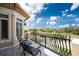 Private balcony with seating and serene views of the neighborhood at 48 Colony Point Dr, Punta Gorda, FL 33950