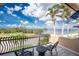 Relax and enjoy the gorgeous water view from this amazing balcony with black metal railings and outdoor seating at 48 Colony Point Dr, Punta Gorda, FL 33950