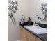 Charming powder room features a modern sink, granite countertop, and stylish decorative accents at 48 Colony Point Dr, Punta Gorda, FL 33950