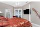 Bright bedroom with decorative bed coverings and ensuite shower at 48 Colony Point Dr, Punta Gorda, FL 33950