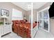 Bright bedroom with decorative bed coverings and ensuite shower at 48 Colony Point Dr, Punta Gorda, FL 33950