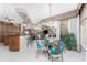 A quaint dining area with pineapple themed decor located off the kitchen area with sliding glass doors at 48 Colony Point Dr, Punta Gorda, FL 33950