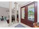 Bright foyer featuring tile floors and a decorative glass front door with a view of the outside at 48 Colony Point Dr, Punta Gorda, FL 33950