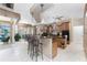The well-appointed kitchen boasts a breakfast bar, wood cabinetry, and modern appliances at 48 Colony Point Dr, Punta Gorda, FL 33950