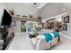 Bright living area with a fireplace, modern decor, and direct access to the backyard area at 48 Colony Point Dr, Punta Gorda, FL 33950