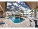 This sparkling pool has a glass enclosure, a built-in spa, elegant fountains and plenty of room to relax at 48 Colony Point Dr, Punta Gorda, FL 33950