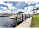 Waterfront property featuring a private boat dock, offering easy access to the water and scenic views at 48 Colony Point Dr, Punta Gorda, FL 33950