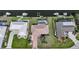 Aerial view of a waterfront home with a pool, boat dock, and lush landscaping at 530 Matares Dr, Punta Gorda, FL 33950