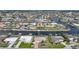 Aerial view showcasing a waterfront community with canals, homes, and boat docks at 530 Matares Dr, Punta Gorda, FL 33950