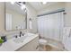 Bathroom with a white vanity, black hardware, and neutral tones creates a relaxing atmosphere at 530 Matares Dr, Punta Gorda, FL 33950