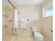 Bright bathroom featuring a tiled shower, marble floors, and modern fixtures at 530 Matares Dr, Punta Gorda, FL 33950