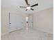Bedroom with ceiling fan, closet, and an en-suite bathroom at 530 Matares Dr, Punta Gorda, FL 33950