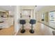 Dining area with bar seating and sliding doors to the outside deck, with an easy flow to the kitchen at 530 Matares Dr, Punta Gorda, FL 33950