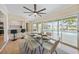 Dining area offers pool views, seamless transition to kitchen, and wet bar, creating a relaxing space for dining at 530 Matares Dr, Punta Gorda, FL 33950