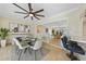 Elegant dining area with fireplace flows into adjacent living space with large windows offering pool views at 530 Matares Dr, Punta Gorda, FL 33950
