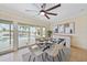 Bright dining room with a large ceiling fan and views of the pool area, making it perfect for gatherings at 530 Matares Dr, Punta Gorda, FL 33950