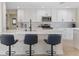 Bright kitchen features white cabinetry, granite countertops, stainless steel appliances, and sleek black hardware at 530 Matares Dr, Punta Gorda, FL 33950