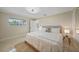 Bright main bedroom with a king bed, and a view of the screened-in pool at 530 Matares Dr, Punta Gorda, FL 33950