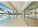 Covered outdoor patio with a swimming pool and views of the canal at 530 Matares Dr, Punta Gorda, FL 33950