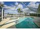 Screened-in pool area with hot tub and canal views at 530 Matares Dr, Punta Gorda, FL 33950