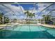 Inviting screened-in pool area overlooking the canal, perfect for relaxation and enjoying waterfront views at 530 Matares Dr, Punta Gorda, FL 33950