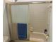 This bathroom features a shower with glass doors and beige tiling at 6728 Thorman Rd, Port Charlotte, FL 33981