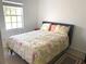This bedroom features neutral colored walls and a window providing natural light at 6728 Thorman Rd, Port Charlotte, FL 33981