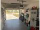 View of a spacious garage with an open door leading to the neighborhood at 6728 Thorman Rd, Port Charlotte, FL 33981