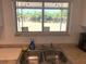 Kitchen sink with a scenic view overlooking the backyard and canal at 6728 Thorman Rd, Port Charlotte, FL 33981