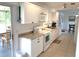 Bright kitchen with white cabinets, ample counter space, and modern appliances at 6728 Thorman Rd, Port Charlotte, FL 33981