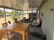 This screened patio includes string lights and ample seating with a view of the water at 6728 Thorman Rd, Port Charlotte, FL 33981
