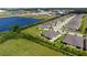This aerial view shows the location of the home near a pond and green space within the community at 7209 W Lenox Cir, Punta Gorda, FL 33950