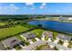 This aerial shows the home's proximity to a lake and recreational facilities, set in a lush, green neighborhood at 7209 W Lenox Cir, Punta Gorda, FL 33950