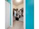 Walk-in closet offers ample storage space with organized shelving and hanging racks at 7209 W Lenox Cir, Punta Gorda, FL 33950