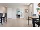 Welcoming foyer with study, adjacent to a dining room, features neutral paint and tile floors at 7209 W Lenox Cir, Punta Gorda, FL 33950